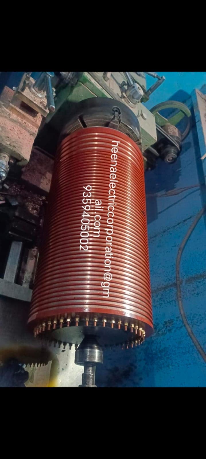 Large multi-ring slip ring assembly being machined on a lathe at Heena Electric Corporation workshop